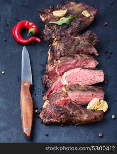 beef grilled steak. Grilled beef steak sliced on cutting board