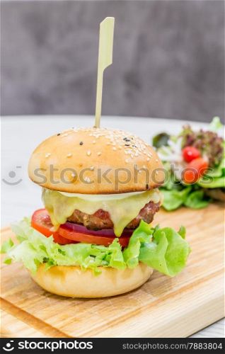 Beef hamburger cheese on wooden dish