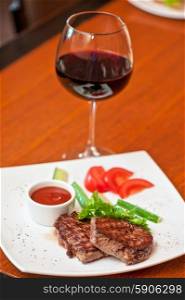 beef meat and wine. grilled beef steak with sauce and wine