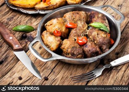 beef roulade stuffed with minced meat, garlic and spice. beef roulades in a metal bowl