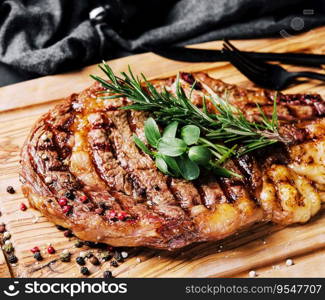 Beef rump steak on wooden table