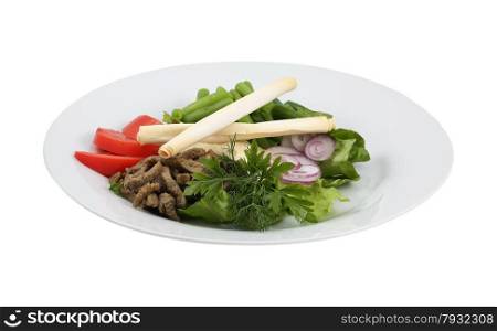 Beef salad and fresh vegetables n an isolated background. Beef salad and fresh vegetables
