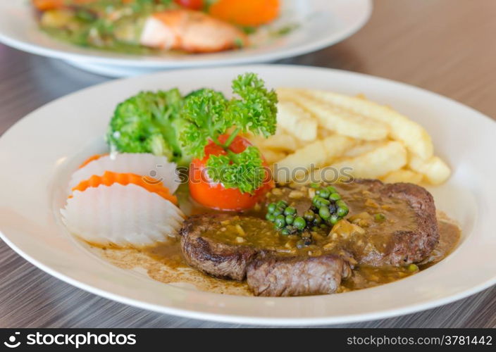 beef steak. close up beef steak with green peppercorn sauce