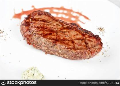 beef steak. grilled beef steak with sauce at plate