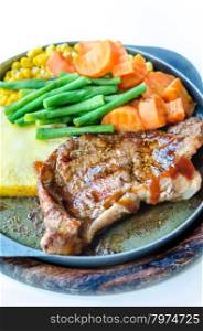 beef steak. Grilled Steak on Cast Iron Pan with vegetables on the Side