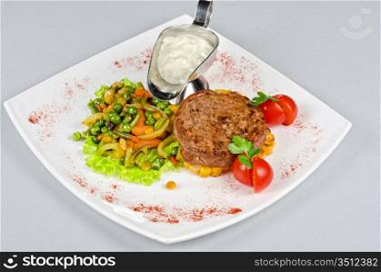 Beef steak meat with vegetables and sauce