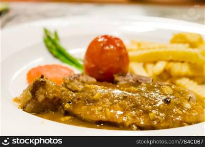 beef steak with vegetable , tomato and french fries