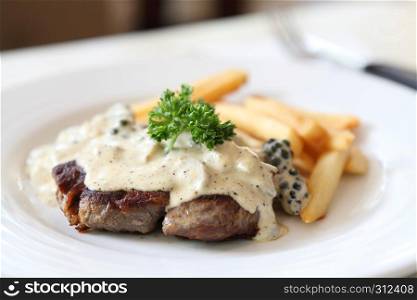 Beef steak with white sauce