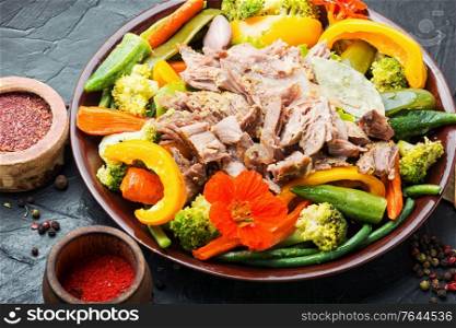 Beef stew with seasonal vegetables.Beef meat baked with vegetables. Stewed meat in vegetables
