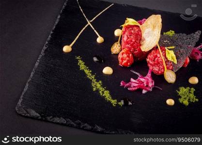 Beef tartare with various dip and vegetables