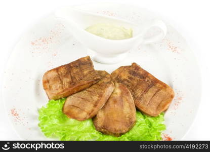 Beef tongue closeup with sauce isolated on a white background