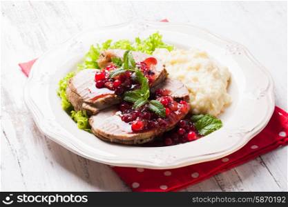 Beef with cranberry sauce and mashed potato