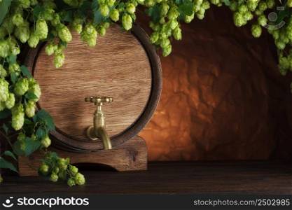 Beer barrel with fresh hops on wooden table still-life