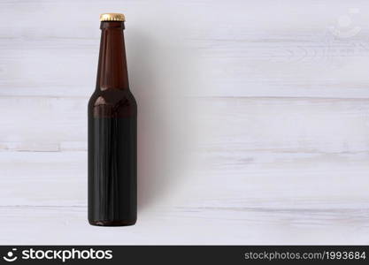 Beer Bottle Mock-Up with Blank Label on wooden background . oktoberfest concept.