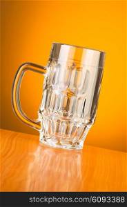 Beer glass against gradient background