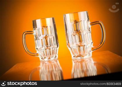 Beer glass against gradient background