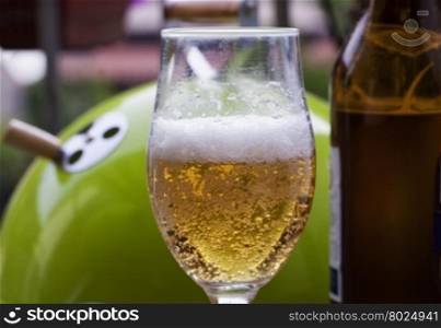 Beer glass with barbecue on the back, horizontal image