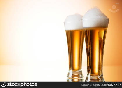 Beer glasses against the colorful gradient background