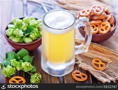 beer in glass and on the wooden table