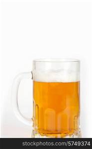 beer into glass on white background. beer glass