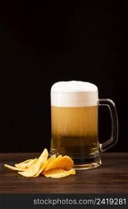 beer mug with chips wooden board