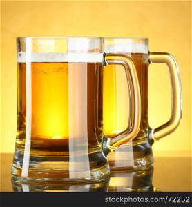 Beer mugs with froth close up