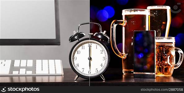 beer party after working day. Glasses of beer, office computer with clock and mobile phone