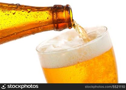 Beer pouring into glass on a white background