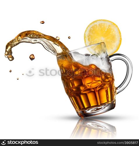 Beer splash in glass with lemon isolated on white