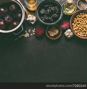 Beet root salad ingredients with pine nuts, chickpeas and prunes on dark background, top view with copy space for your design. Healthy clean, low calories food and diet and detox eating concept