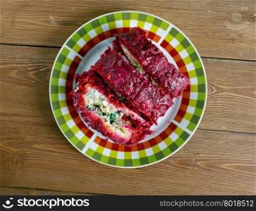 beet roulade with vegetables and feta cheese.
