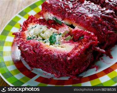 beet roulade with vegetables and feta cheese.
