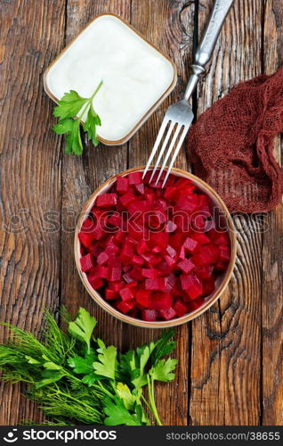 beet salad in bowl and on a table