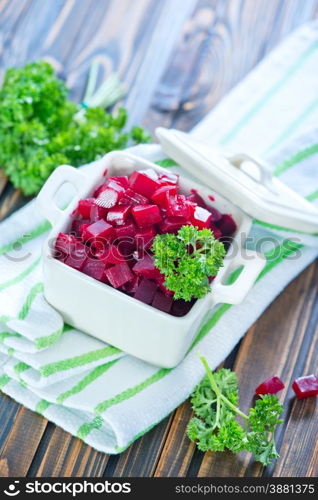 beet salad in bowl and on a table