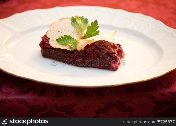 beet salad with rusk bread at plate