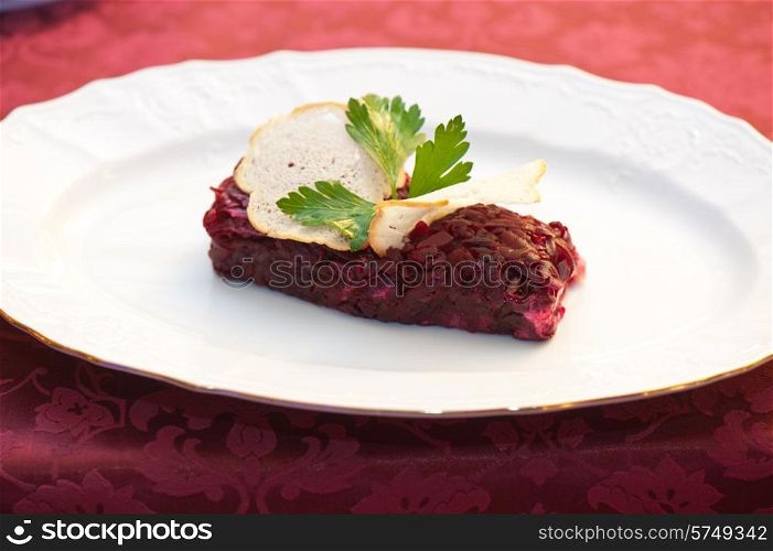 beet salad with rusk bread at plate. beet salad