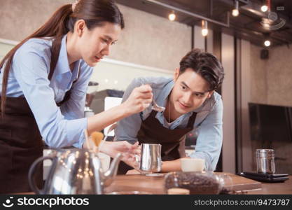 Before competing in the ch&ionship level coffee brewing competition, both of the baristas practice their coffee latte makeup techniques to become proficient.