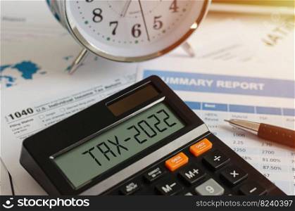 Beginning of taxes in 2022 with a calculator that calculates income In the business concept of paying taxes, withholding taxes in the new year 2022 and as a rule