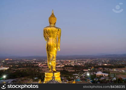 behind Buddha statue before sunset time at Wat Phra That Kao Noi Nan, Thailand