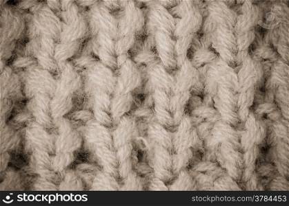 Beige knitted wool texture can use as background.