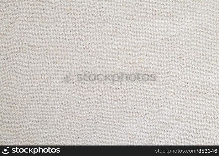 Beige linen fabric texture background, detail closeup