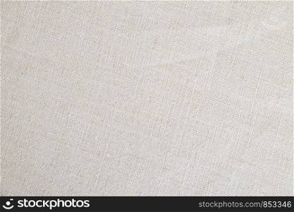 Beige linen fabric texture background, detail closeup
