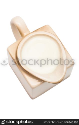 Beige milk jug on a white background