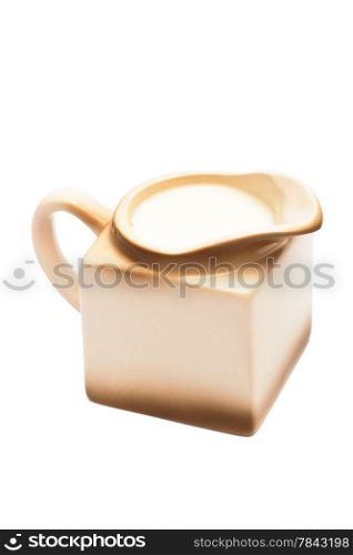 Beige milk jug on a white background