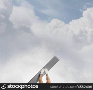 Being on verge. Woman standing on the edge of wooden board