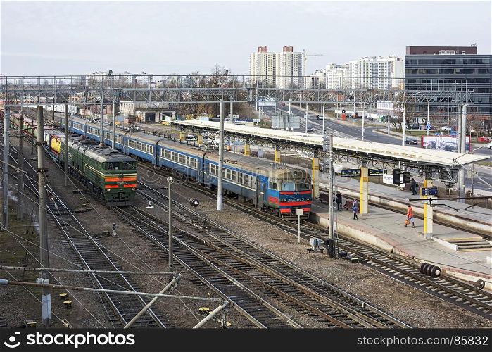 Belarus, Minsk - 03/04/2017: Railway station. Suburban train and freight train
