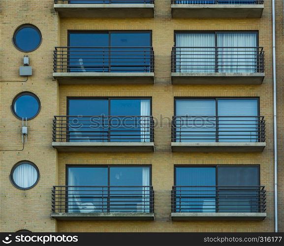 belgian apartments with windows and balconies, city architecture of belgium