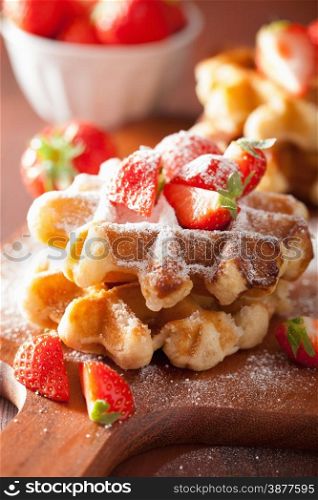 belgian waffles with icing sugar and strawberry