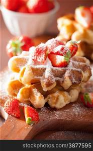 belgian waffles with icing sugar and strawberry
