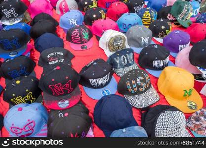 BELGIUM - BOMAL SUR OURTHE - JUNE 4, 2017: Caps on the sunday market at Bomal Sur Ourthe in Belgium.